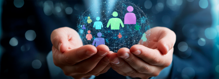 hands holding a bubble with shapes of people inside