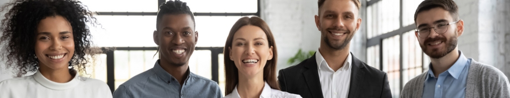 Diverse group of five professionals smiling.